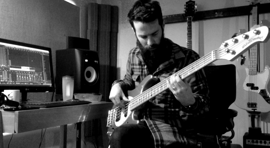 Alex recording the bass part to Chasing Butterflies using his Music Man Sterling 5-string bass guitar